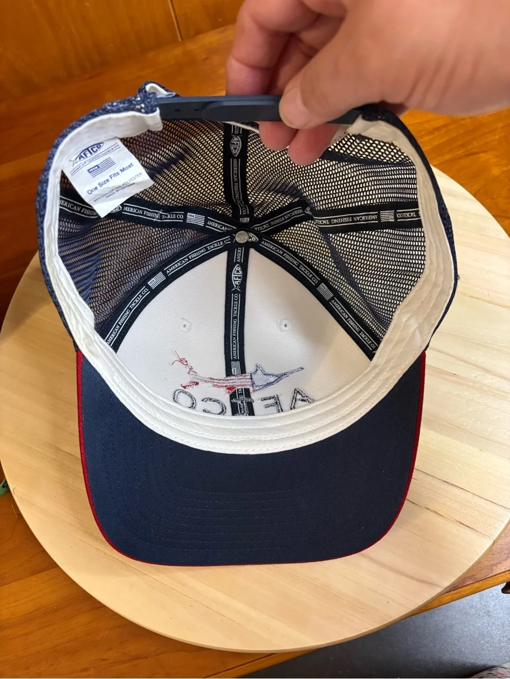 AFTCO Meric trucker hat with an embroidered American flag billfish graphic. NWT